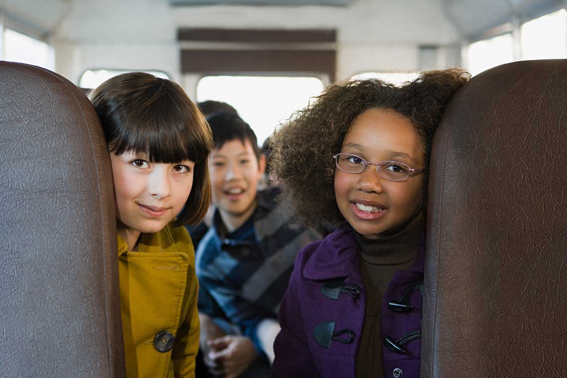 Happy learners on their way to school, safe and supervised